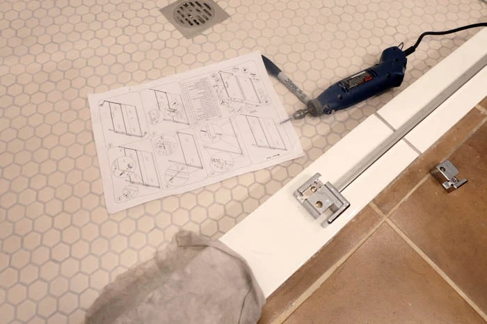 mapping out the glass shower door installation