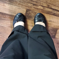 Picture of black pants and black shoes