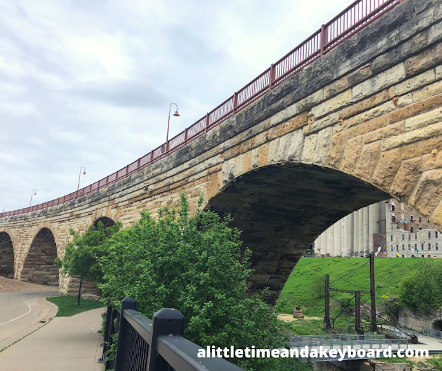Admiring the construction of the Stone Arch Bridge of Minneapolis from below.