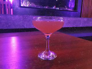 a red cocktail on a table