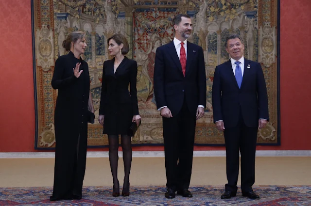 Spanish King Felipe VI and Queen Letizia chat with Colombian President Juan Manuel Santos and his wife Maria Clemencia Rodriguez during the official reception of a dinner held at El Pardo Palace in Madrid, Spain,