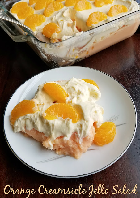 Creamy orange jello dotted with mandarin slices and topped with a fluffy vanilla topping makes for a perfectly refreshing and delicious orange creamsicle jello salad! Creamy orange jello dotted with mandarin slices and topped with a fluffy vanilla topping makes for a perfectly refreshing and delicious orange creamsicle jello salad!
