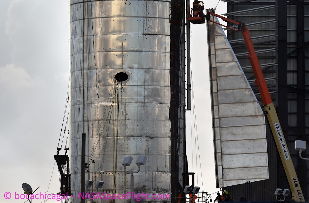 Attaching first fin to SpaceX Starship Mk1 (photo by BocaChicaGal)