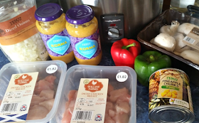 chicken, onions, jars of curry sauce, peppers, mushrooms and pineapple chunks