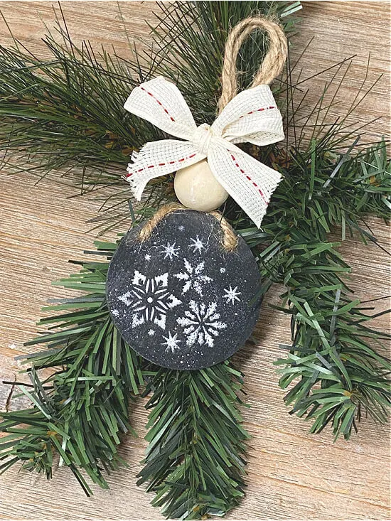 chalkboard ornament with stenciled snowflakes