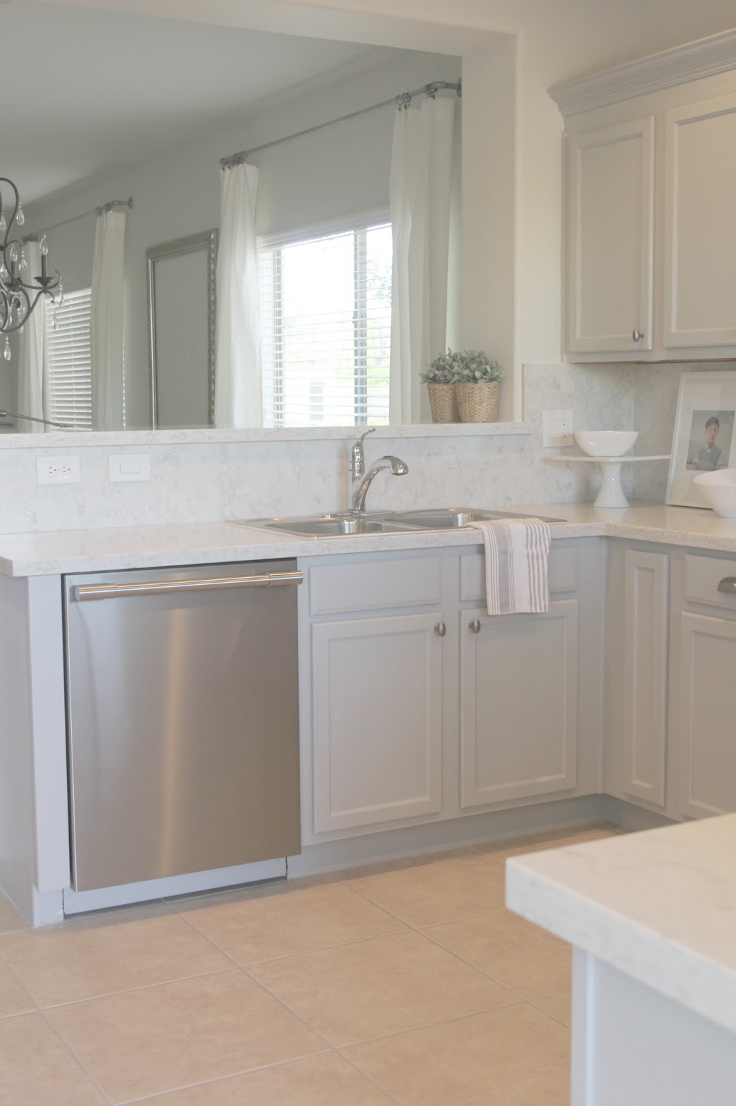 Serene Nordic French style kitchen renovation with pastels and grey cabinets by Hello Lovely studio