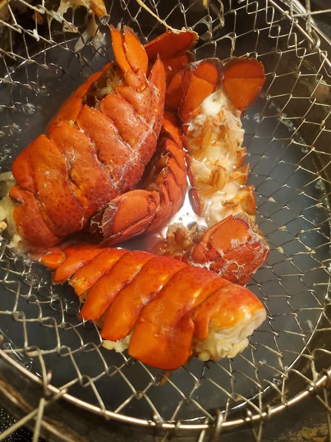 these are maine lobster tails in a wire basket boiled