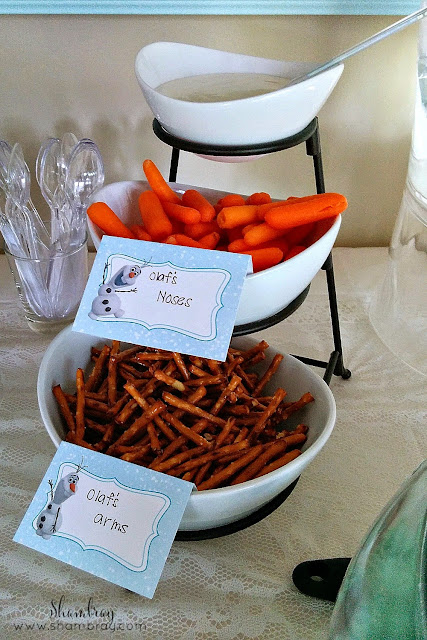 carrots, pretzel sticks, Olaf's noses, Olaf's arms 