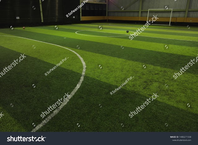 Royalty-free stock photo indoor futsal court with green synthetic grass and clean - Image 