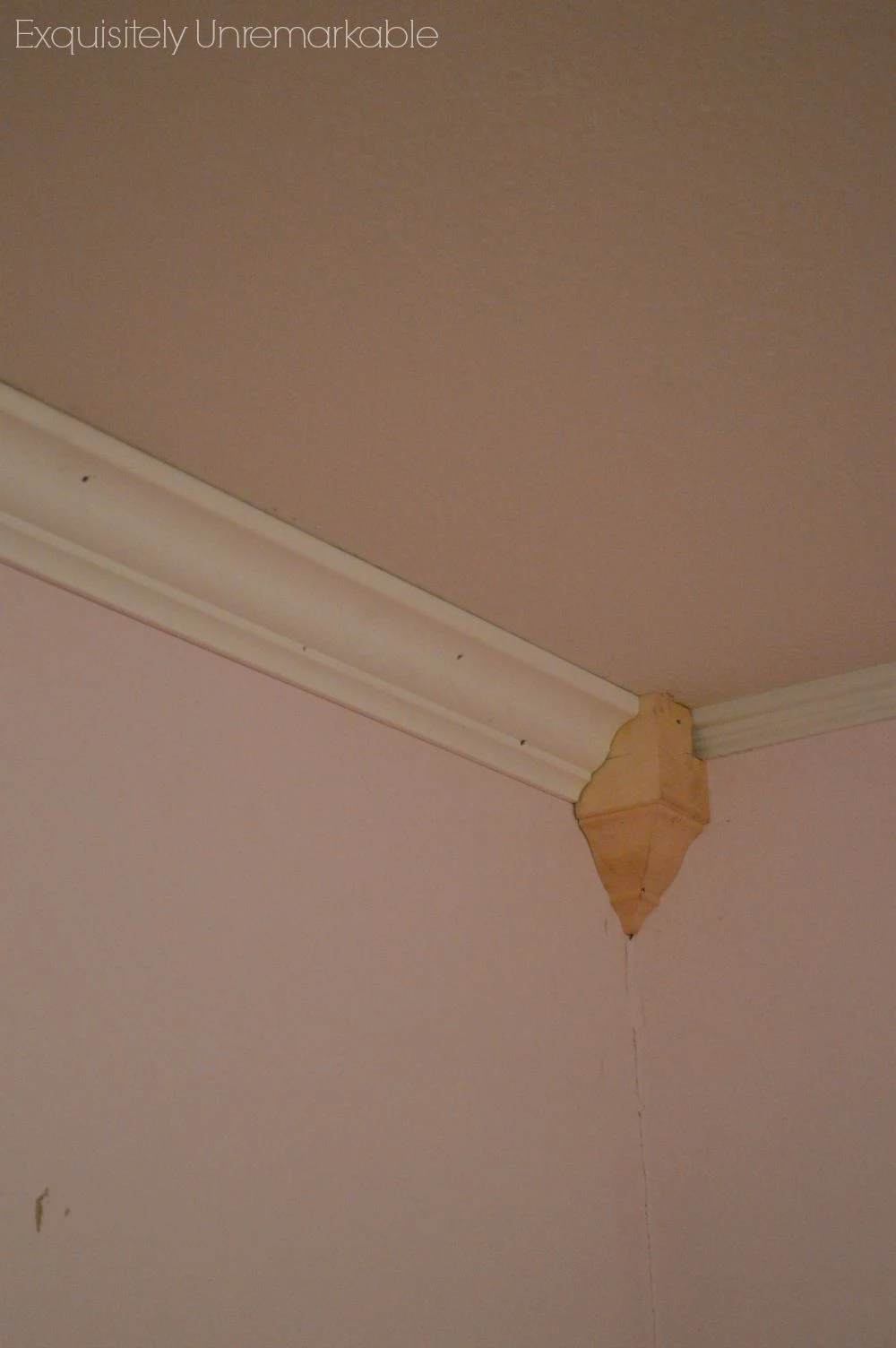 Adding an unfinished Corner Crown Molding block to a pink bedroom