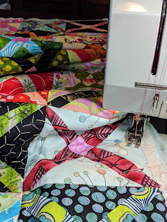 Bernina 1240 is used to stitch in the ditch the sashing and borders of The Square Deal.