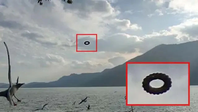 Turista capta misterioso OVNI 'dona' flotando sobre un lago en China