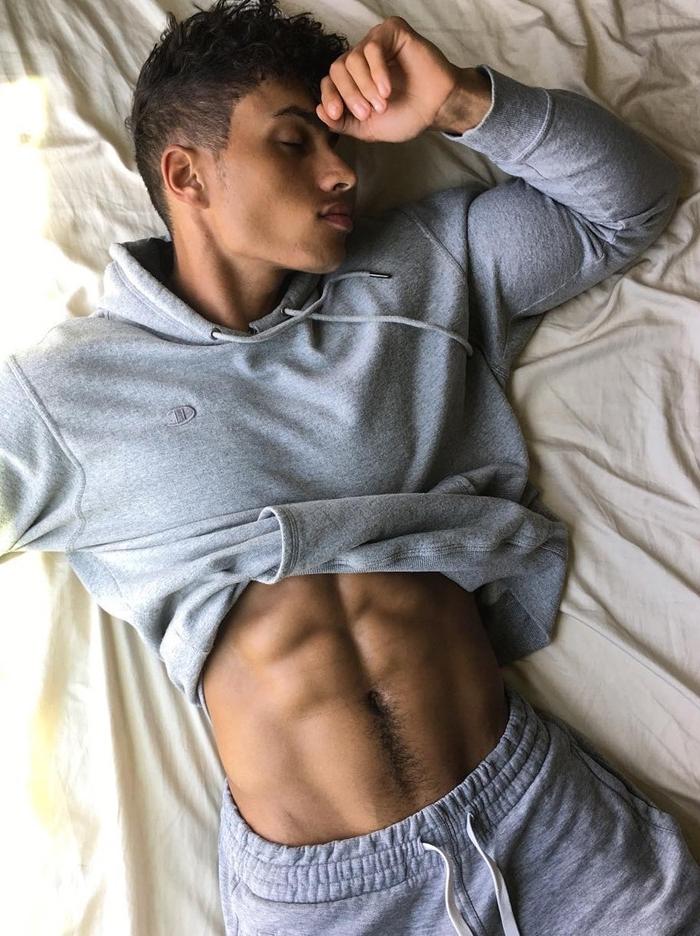 beautiful-shirtless-fit-mixed-black-dude-sleeping-bed-abs-hairy-trail-bicep-trainers-big-lips