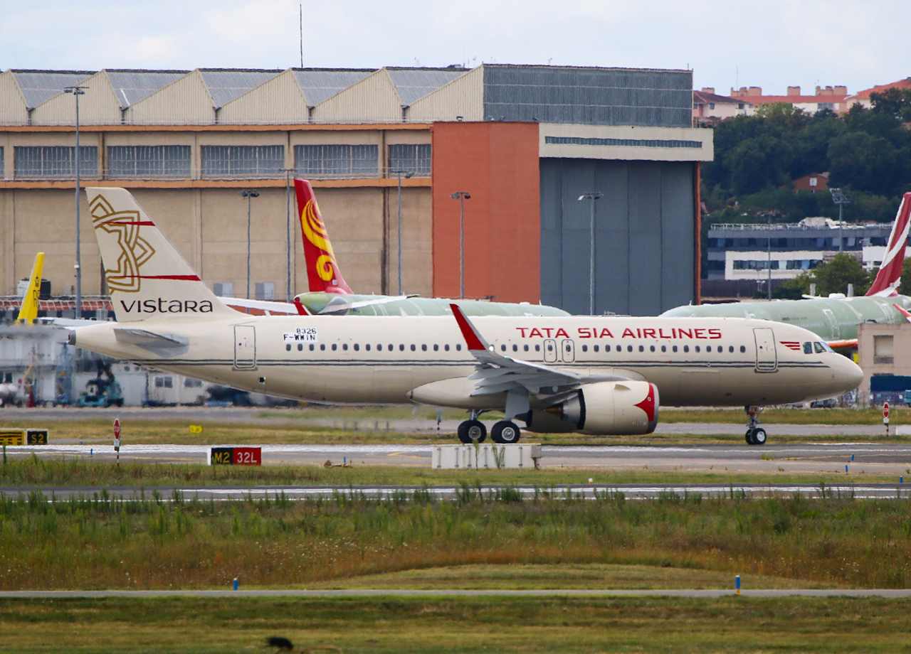 a white airplane on a runway