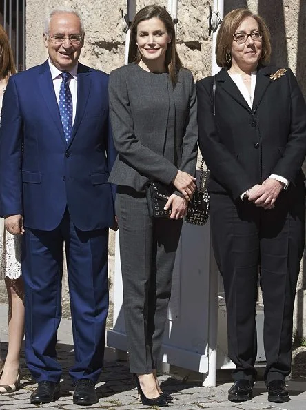 Queen Letizia wore Nina Ricci Pant Suit, Carolina Herrera patent and suede pumps and carried Uterque Studded messenger bag