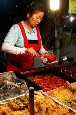 Ahjumma selling ddeokbokki in Dongdaemun Seoul