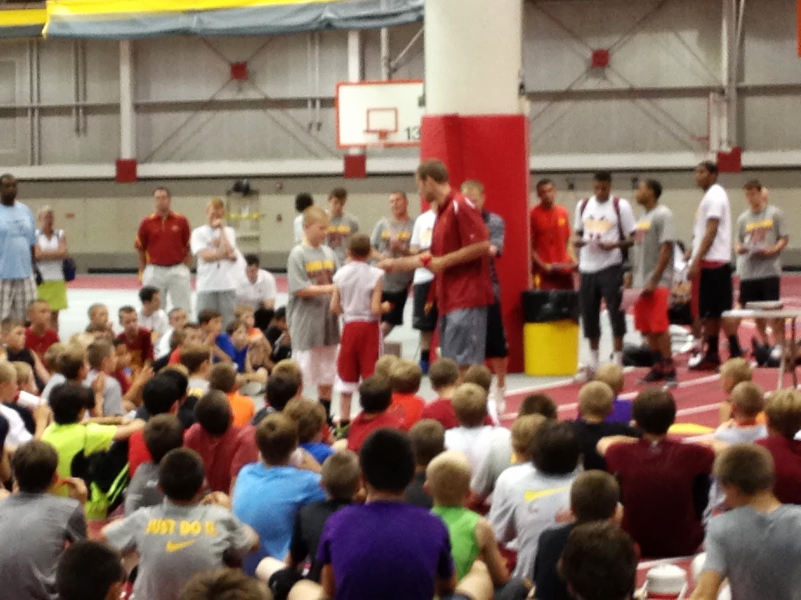 a blonde and 3 boys ISU Basketball Camp...