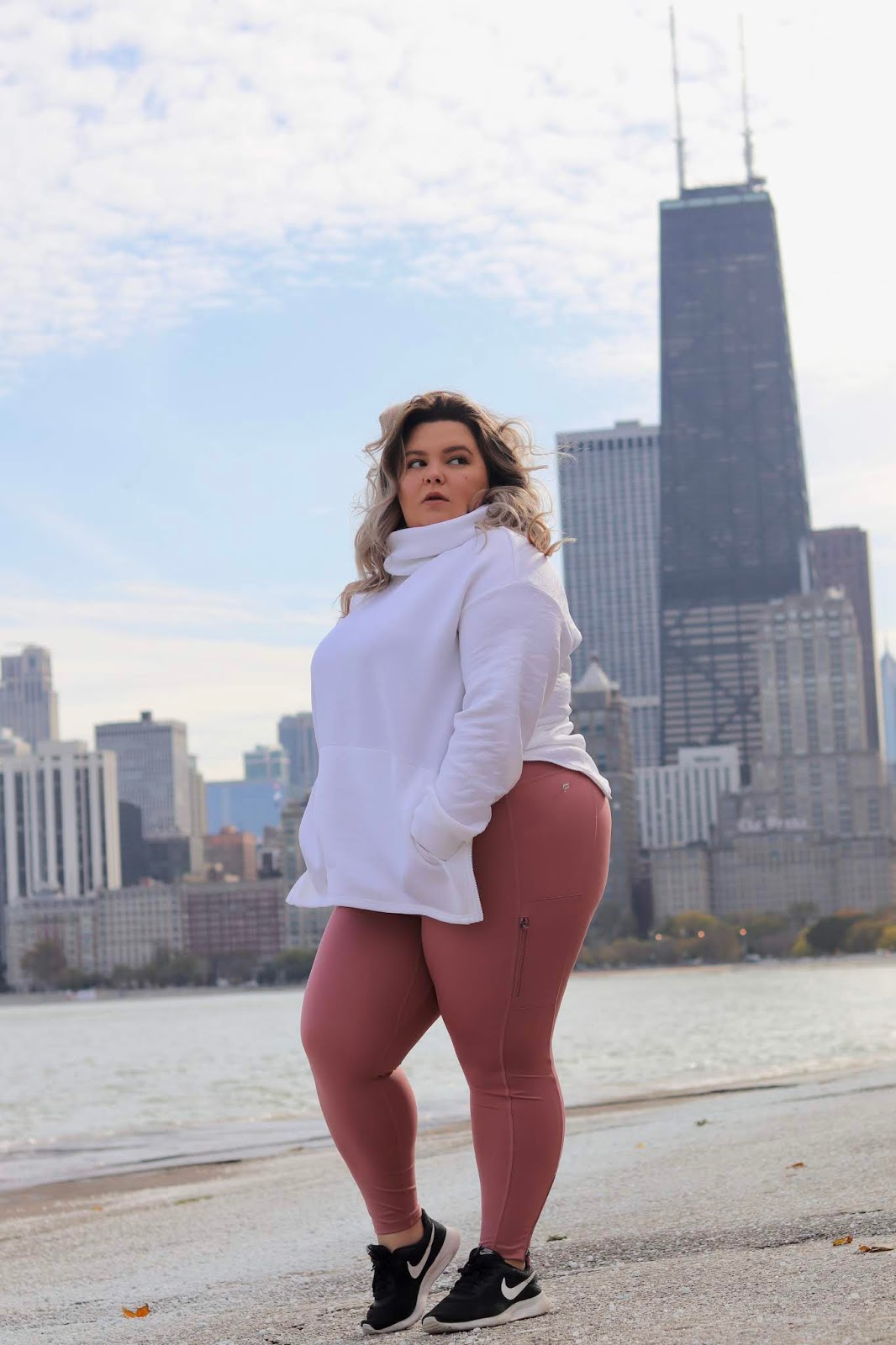 Chicago Plus Size Petite Fashion Blogger, influencer, YouTuber, and model Natalie Craig, of Natalie in the City, reviews Fabletics winter workout attire.
