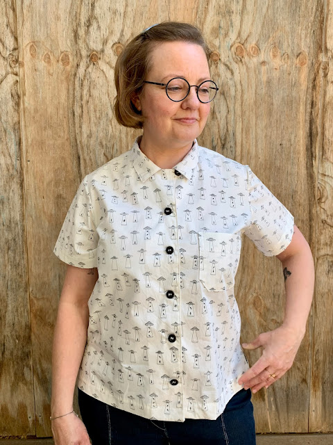 Jane wears Bombazine Shirt pattern made in Alien Abduction print fabric from The Drapery