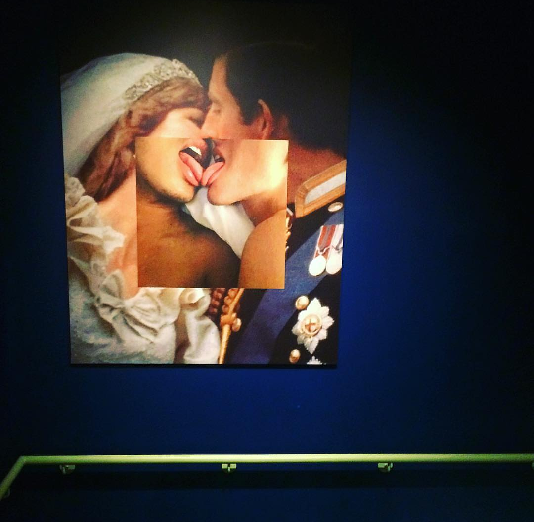 Princess Diana and Prince Charles kissing with tongues on blue wall