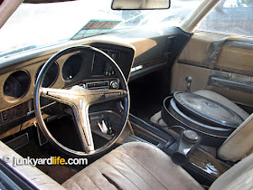 400-V8 air cleaner sits inside the 1969 Grand Prix on the bucket seat.