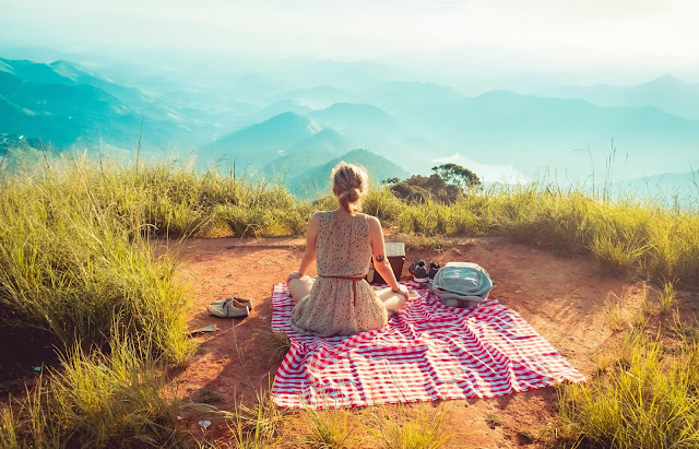 woman overlooking at the mountains, stress free