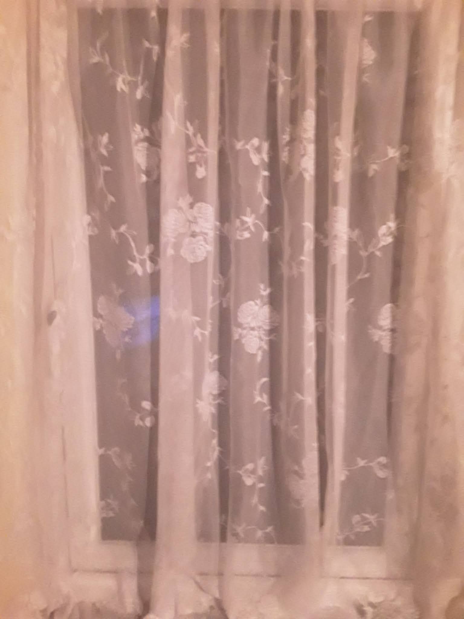 northsider Putting Up The Net Curtains. ("The last of the curtain