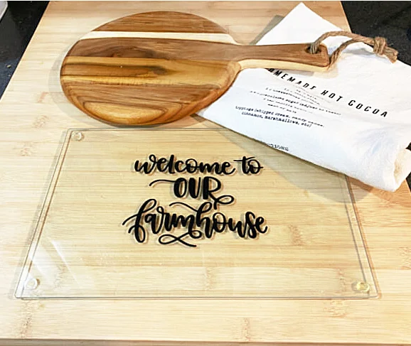 glass cutting board with wooden cutting board and tea towel