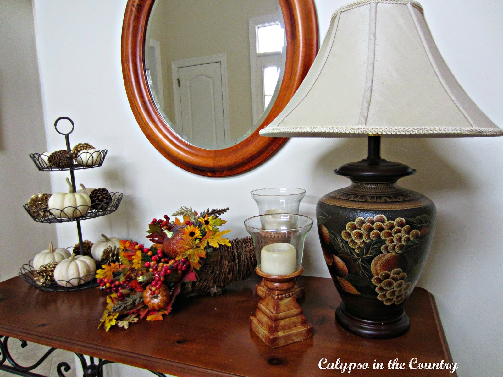 Fall console table Fall Foyer Table with lamp, cornucopia and white pumpkins in tiered tray.