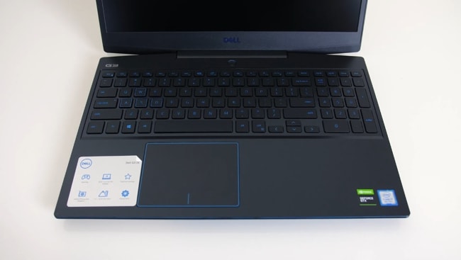 Smooth matte black plastic interior with blue accenting around the touchpad, keys, and everywhere on the laptop