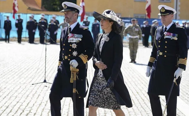 Crown Princess Mary wore a cappotto black coat by Prada, and printed silk dress by MaxMara. Jimmy Choo Billie pumps