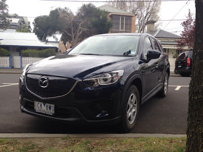 Handsome lines of the Mazda CX-5 slightly disguised by dark blue colour choice  