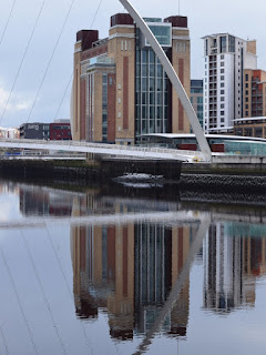 A reflection of The Baltic Arts building in the River Tyne