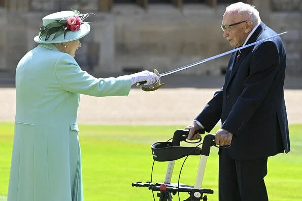 Queen Elizabeth II conferred the Honour of Knighthood on Captain Tom Moore at an Investiture at Windsor Castle in Windsor. turquoise coat