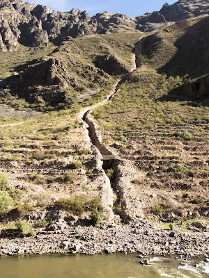 Channel leading to the Urubamba River in Ollantaytambo Peru
