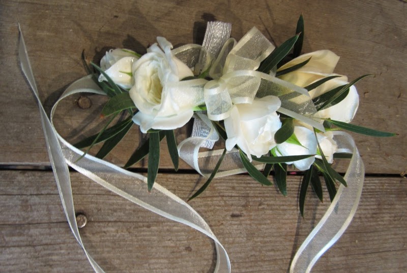 Sammy’s Flowers Classic white corsages