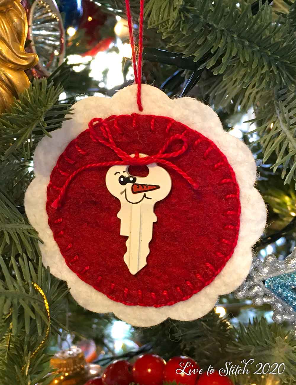 Blanket-stitched felt ornament with key