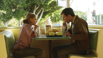 Ed Helms and Amanda Seyfried in The Clapper