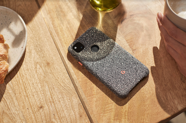 Grey Pixel phone case sitting on a wood table