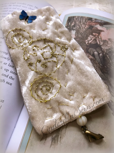Cinderella Coach Hand Embroidered Bookmark - This keepsake bookmark features metallic gold thread, Swarvski and Czech glass beads, and a tiny brass slipper shoe charm for book lovers looking for a special bookmark. Click for m ore information about the bookmark and artist who makes it! #cinderella #handmadegifts #supportsmallbusiness #handembroidery #fairytale #onceuponatime #cinderella2015 #cinderellaaesthetic #bookmark