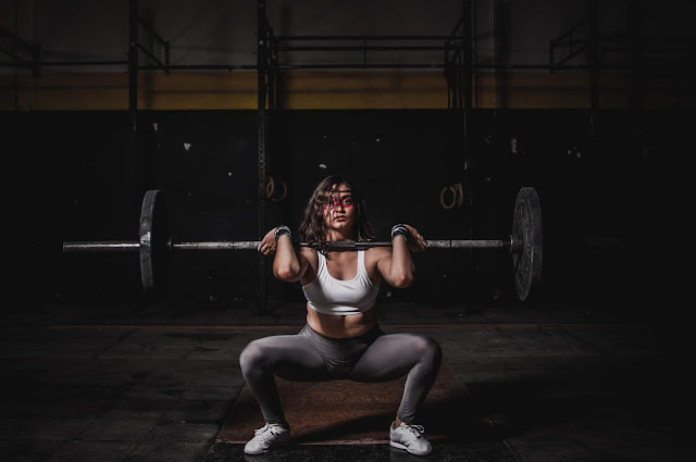 Woman Using Tips From Workout Motivation For Females In The Gym