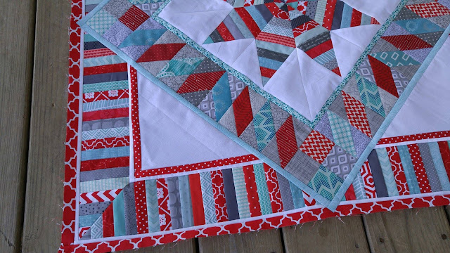 red and aqua round robin quilt