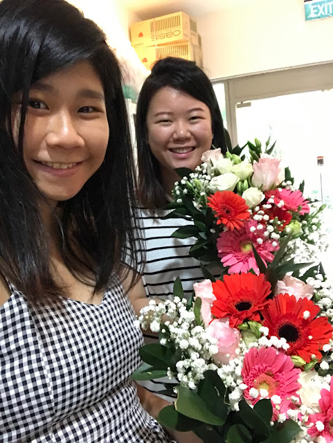 angie and adeline pleased with their bouquet of flowers