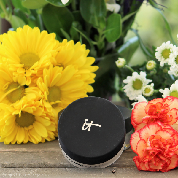 A good setting powder can make or break your look. You want one that is finely milled so that when you lightly dust it over your makeup, it doesn't look cakey. #sponsored #skincare #beauty #rosacea #sensitiveskin #aloevera #lexli #over50 #enjoytheviewblog jar of powder sitting in front of yellow and orange flowers