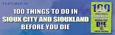 the lime green cover of 100 Things to Do in Sioux City & Siouxland Before You Die appears against a blue sky background, and the title name appears in large block letters next to the book