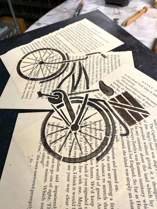 Stenciled Bicycle image using Decoupaged Book Pages
