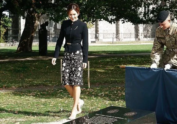 Crown Princess Mary wore a black and white floral dress from Ralph Lauren, and a structured mock-neck blazer from Max Mara. Naledi Gianvito Rossi