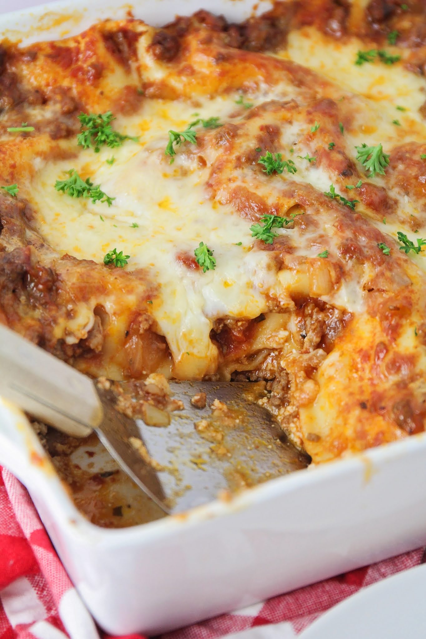 This delicious lasagna is truly the best! The recipe makes two pans, so it's easy to bake one and put another in the freezer for later!