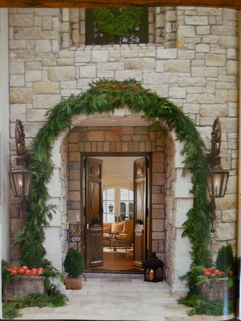 Stone clad exterior of a magnificent French home with interior design by Pamela Pierce.