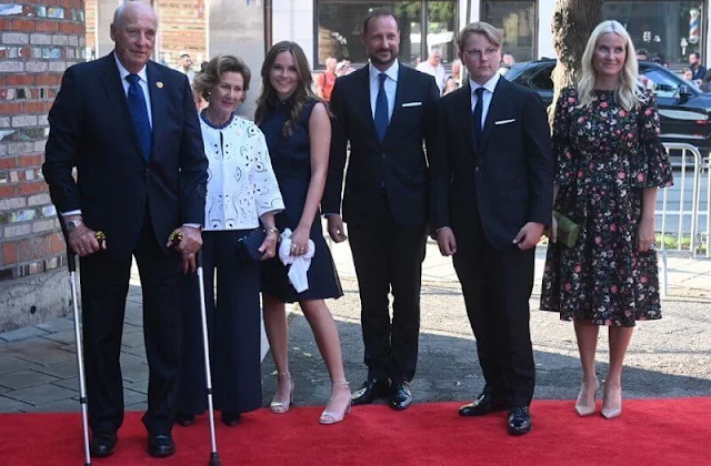 Crown Princess Mette Marit wore an aleena floral print matelasse dress by Erdem. Queen Sonja and Princess Ingrid Alexandra